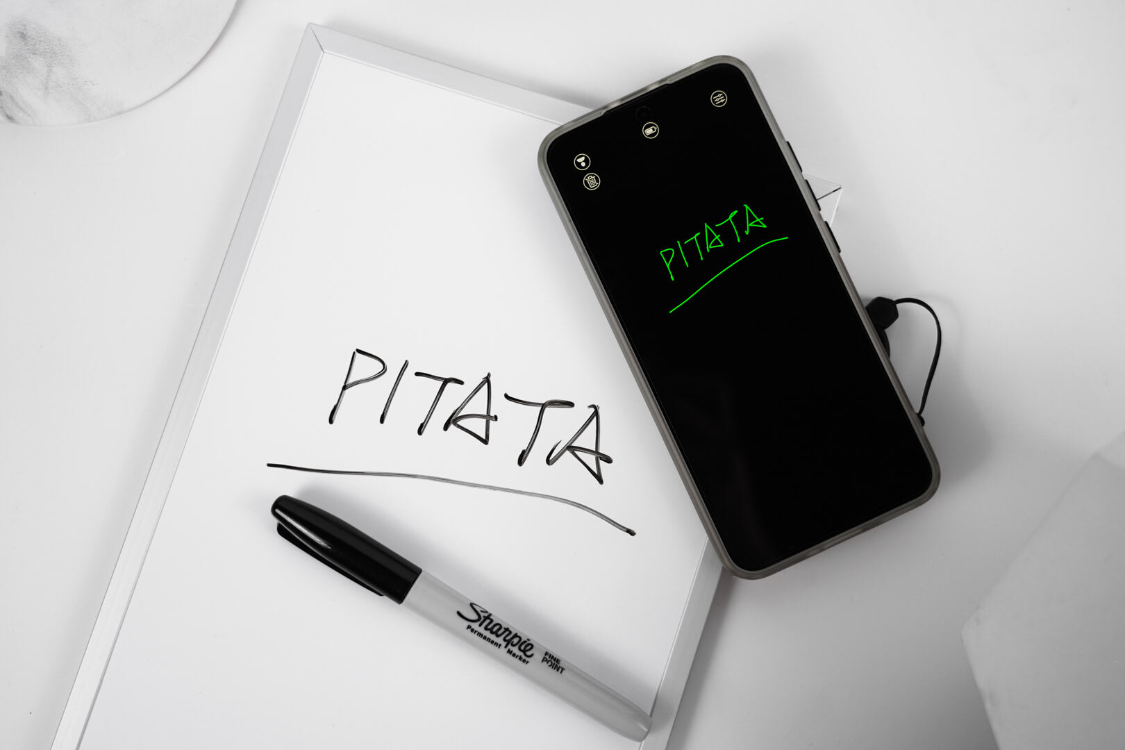 Real PITATA writing impression displayed on a smartphone