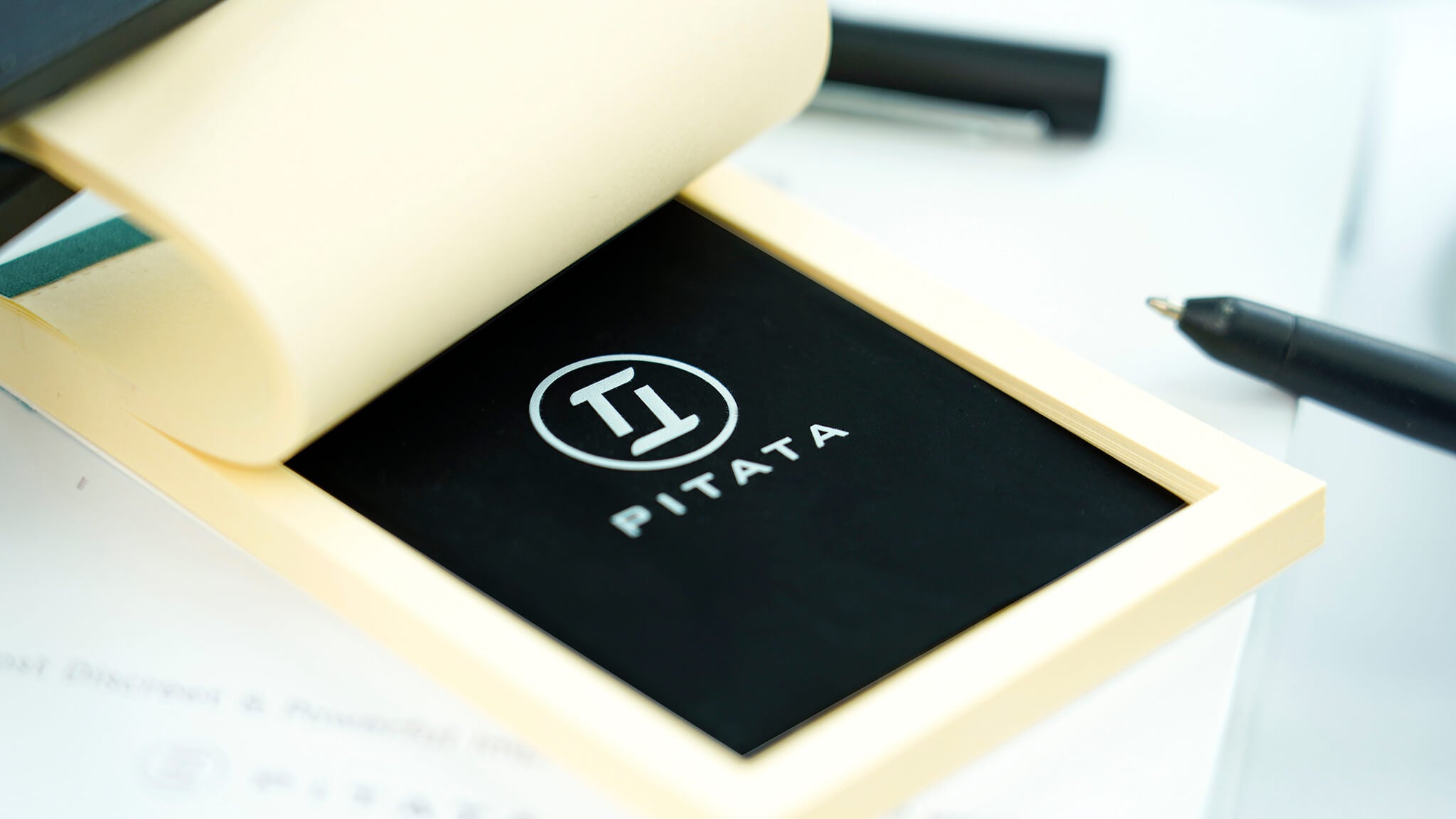 Close-up of a real PITATA Smart MemoPad beneath its paper